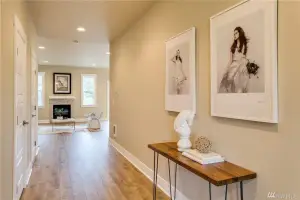 Light oak wide-plank hardwood floor, entry hallway