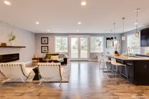 Warm hand-scraped oak hardwood floor, open great room