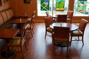 Cherry-toned wood-look floor, café dining room