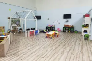 Weathered gray wood-look vinyl plank floor, childcare center