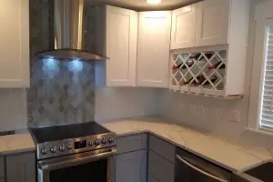 Gray hexagon and marble herringbone tile backsplash, kitchen