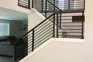 Dark hardwood floor with matching open staircase, foyer