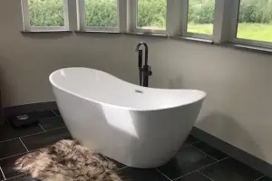 Charcoal slate-look large-format tile floor, bathroom