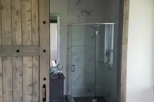 White marble-look tile floor and shower, bathroom
