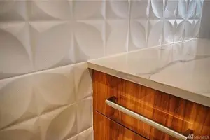 Three-dimensional white geometric wall tile, powder room