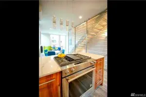 Light wood-look plank floor, kitchen with gas range